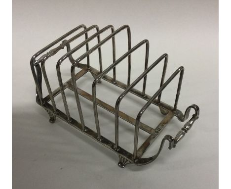 A good quality Arts and Crafts silver five bar toast rack on bracket feet. Sheffield. By HA. Approx. 229 grams. Est. £250 - £