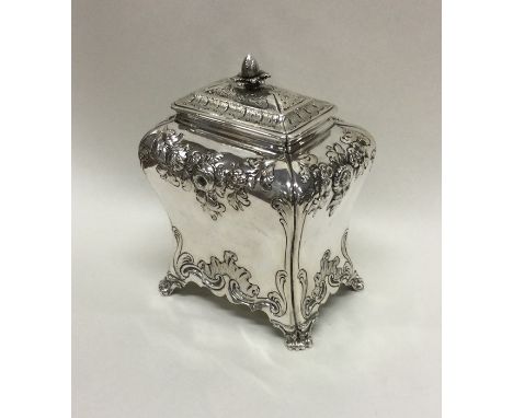 A good George III chased silver tea caddy of Rococo design. London 1760. By IPG. Approx. 243 grams. Est. £800 - £1200.