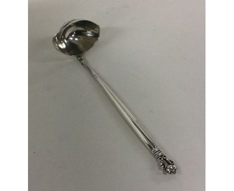 GEORG JENSEN: A stylish silver cream ladle of typical design. Approx. 24 grams. Est. £50 - £80.
