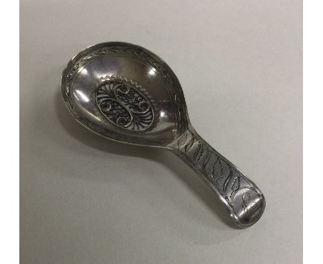 A Georgian silver boat shaped caddy spoon with filigree decoration. Birmingham. By Samuel Pemberton. Approx. 10 grams. Est. £