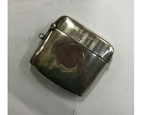 An engine turned silver vesta case with hinged lid. Birmingham . 18 grams, Est. £15 - £20.