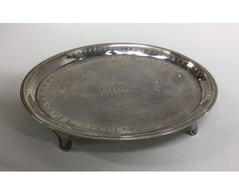 A heavy Georgian silver teapot stand with bright cut decoration. London 1800. By SG&amp;EW. Approx. 112 grams. Est. £100 - £1