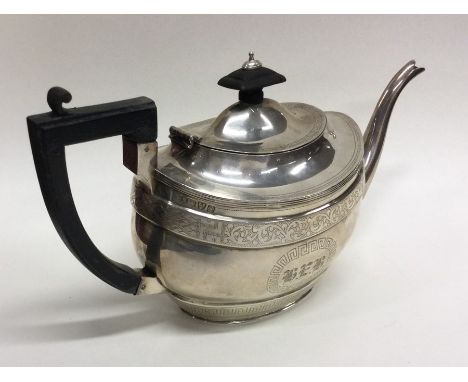 A good Georgian style silver teapot attractively decorated with scrolls and leaves. Chester. Approx. 458 grams. Est. £250 - £