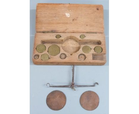 Cased set of 18thC travelling beam scales with flat copper pans and brass weights. Width of case 18cm