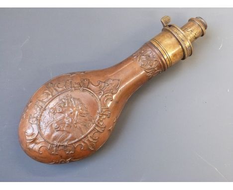 G &amp; J.W. Hawksley copper and brass powder flask with embossed decoration of three horses' heads, 22cm long.