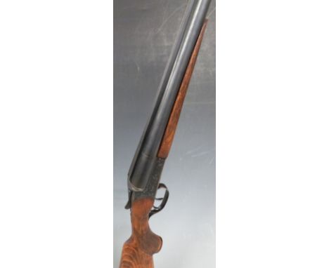 Baikal IJ-58 12 bore side by side ejector shotgun with heavy engraving of stags heads to the locks, chequered semi-pistol gri