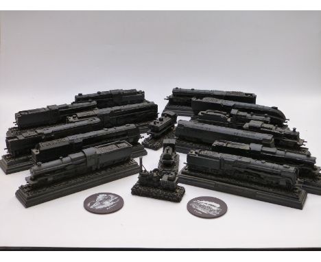 Approximately sixteen 00 gauge model locomotives each carved from a block of coal&nbsp;