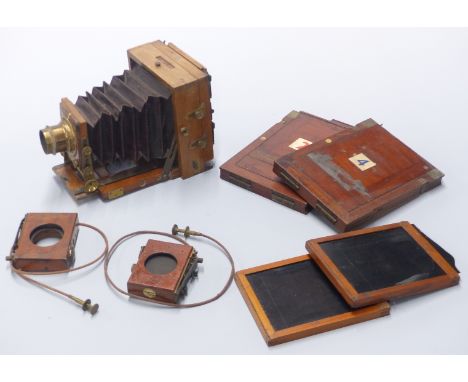 Mahogany and brass folding plate camera with J Lancaster &amp; Sons patent lens, two Thornton Pickard shutters and four vario