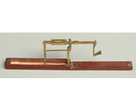 Georgian mahogany cased folding guinea or sovereign scale with flip-over weight and instructions to interior of box