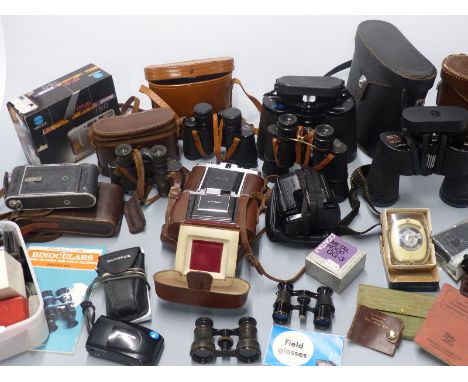 Quantity of binoculars and cameras including Swift 10x50 and 7x50, Eikow 8x40, Zenith 8x30, Zeiss Nettar folding camera, acce
