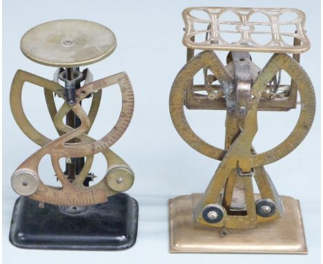 Two pairs of bilateral or swinging weight type postage scales, height of larger 15.6cm