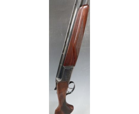 Baikal NX-27E 12 bore over and under ejector shotgun with engraved scenes of birds to the lock, engraved top lever, trigger g