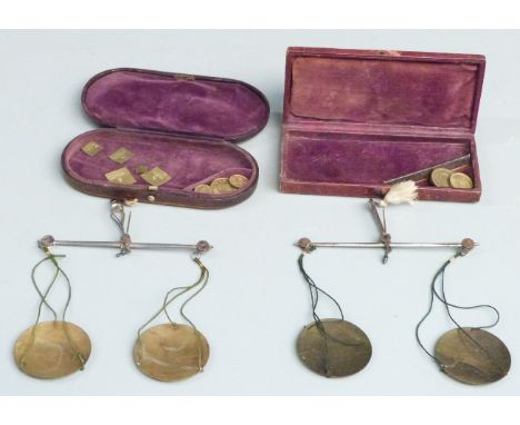 Two W &amp; T Avery cased sets of travelling beam scales, one with sovereign weights, the other apothecary weights, both in l