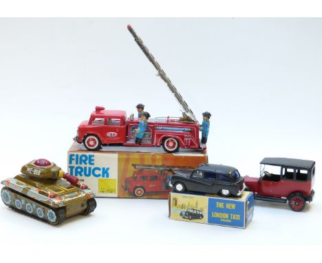 Four tin plate model vehicles including a Japanese friction powered Fire Truck, The New London Taxi etc, two in original boxe