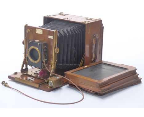 Sanderson plate camera in teak or similar case with Thornton Pickard shutter in canvas covered case with three film slides
