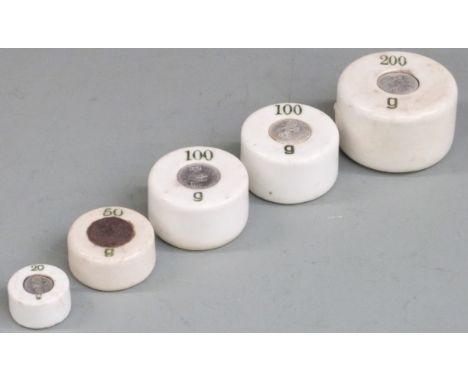 A run of cylindrical ceramic weights 200g to 20g