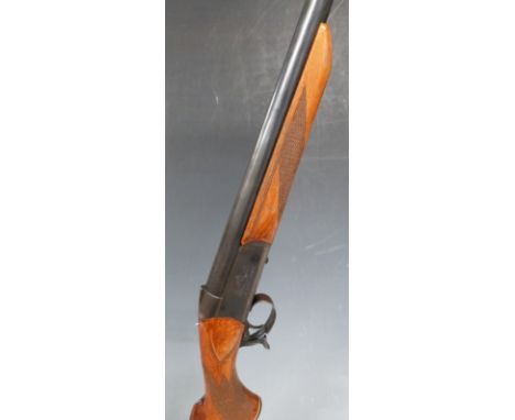 Baikal .12 bore single barrelled shotgun with engraved locks, semi-pistol grip and 28.5 inch barrel choked full, overall leng