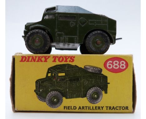 Dinky Toys diecast model Field Artillery Tractor with green body and hubs 688, in original box.&nbsp;