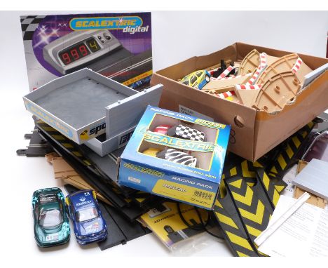 A collection of Scalextric cars, track and accessories including Digital Lap Counter C7039, Racing Pack C2949, buildings, spe