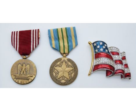 United States of America medals comprising a Good Conduct Medal and Outstanding Volunteer Service example together with ename