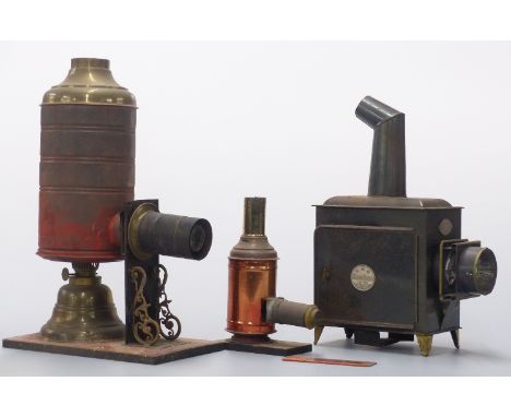 Three magic lantern type projectors including one marked A W Gammage Ltd