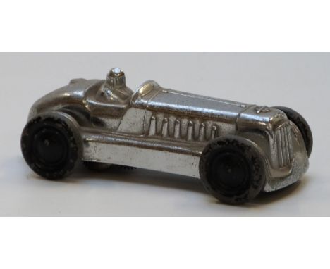 Gaiety Toy Castle Art Product clockwork model racing car with chrome body and driver and black metal wheels.&nbsp;