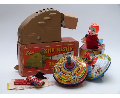 Chad Valley Humming Spinning top together with one similar, a Mattel Jack In the Music Box and The Strip Master 35mm Film Str