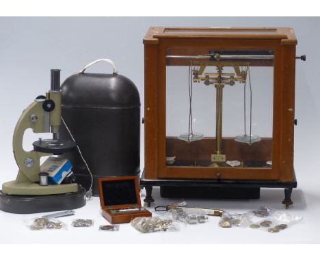 Russian microscope in carry case, Stanton London cased laboratory scales and a quantity of apothecary and similar weights