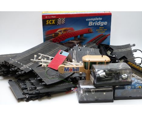A collection of Scalextric model slot car racing cars, track, buildings and accessories, some in original boxes