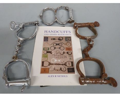 Three pairs of vintage handcuffs, book etc