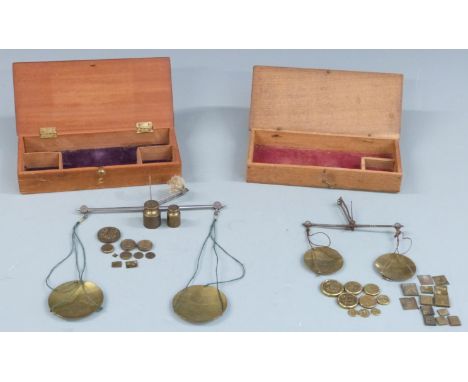 Two sets of 18thC / 19thC travelling beam scales both with Avery troy ounce weights. Width of larger case 20cm