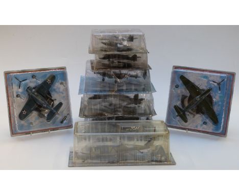 Eight approximately 1:72 and 1:144 scale diecast model aircraft including UH-60L Blackhawk, Focke-Wulf, Douglas SB0-3, Dauntl