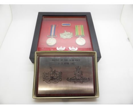 British Army WWII medals comprising War Medal and Defence Medal in presentation case with Gloucestershire regimental cap badg