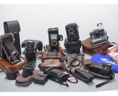 Collection of vintage cameras including Lubitel 166B TLR, Seikosha , Poloroid, Zeiss Ikon Nettar etc