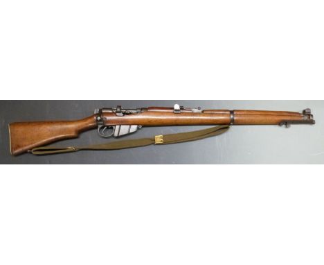 Deactivated Short Magazine Lee Enfield SMLE .303 bolt action rifle with ladder sight, canvas sling, brass butt plate with sto