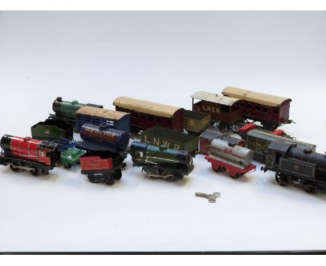 Seventeen Hornby 0 gauge tinplate locomotives, coaches, wagons, vans and tankers including BR clockwork locomotive 82011, Red