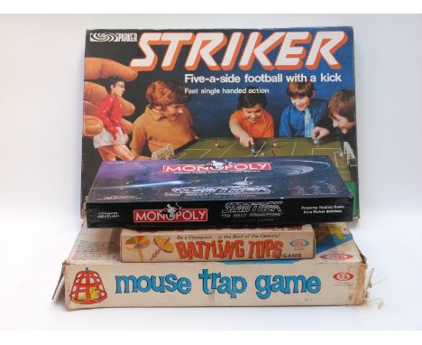 Four vintage games comprising Monopoly Star Trek The Next Generation Collectors Edition, Striker, Mouse Trap and Battling Top