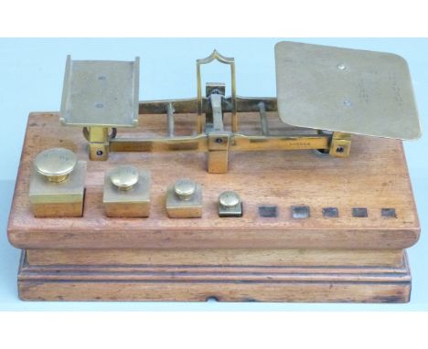 Waterlow &amp; Sons, London, Victorian postage scales with square tapering weights from 6oz to 2/3oz, on mahogany base, width