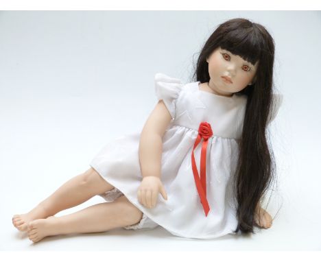 Donna Rubert Chyna bisque doll Helen with closed mouth, fixed light brown eyes and long black hair marked to the back of the 