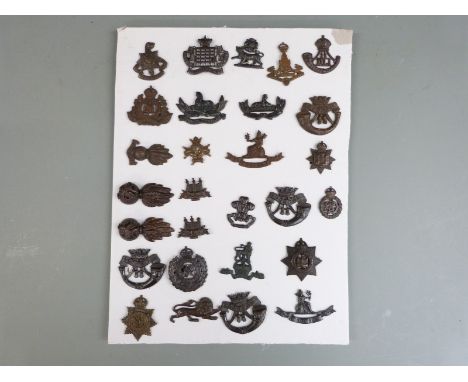 Twenty eight British Army officers' cap and collar badges including Royal Gloucestershire Hussars, Cornwall Light Infantry, S