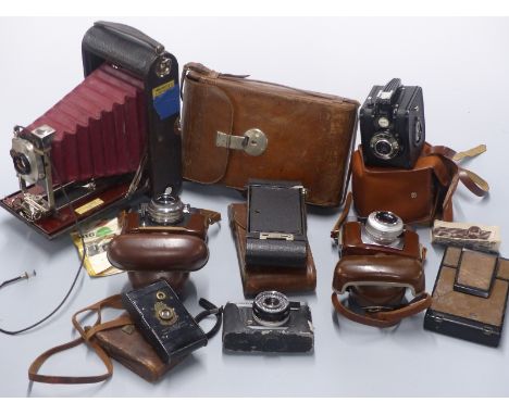 A collection of vintage cameras including large Kodak folding camera in leather case marked Major A J Craven, Voigtlander Vit