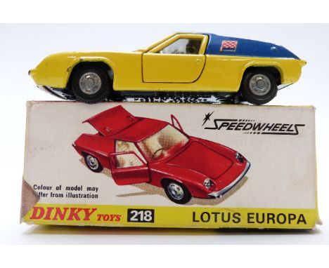 Dinky Toys diecast model Lotus Europa, with yellow body, blue roof and side panels, gold engine and chequered flags, 218, in 