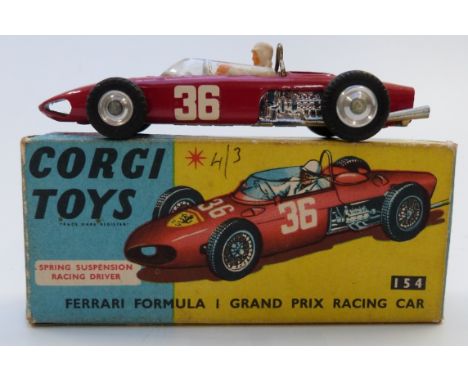 Corgi Toys diecast model Ferrari Formula 1 Grand Prix Racing Car with red body, white driver and racing number 36 154, in ori