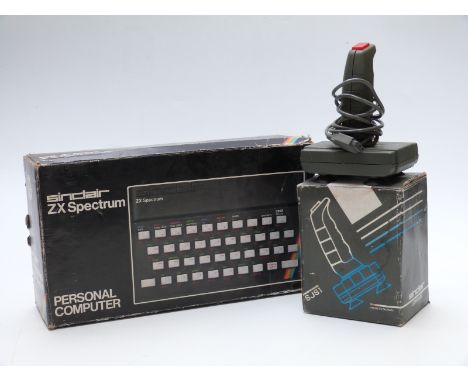 Sinclair ZX Spectrum vintage personal computer together with a matching Joystick SJS1, both in original boxes.&nbsp;