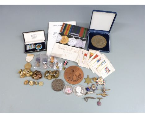 A collection of militaria to include buttons, RAF &amp; Navy, Regimental enamel badges, Somerset Light Infantry, WWI Red Cros
