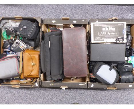 Large quantity of cameras and accessories including Praktica LTL SLR camera, Ricoh 500G, Polaroid, Sanyo video camera, JVC di
