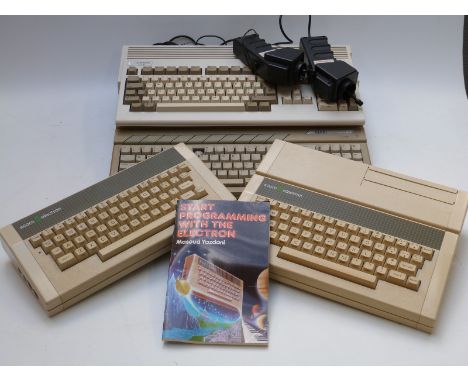 Four vintage personal computers comprising Atari 520ST, Commodore Amiga A1200 and two Acorn electron.&nbsp;