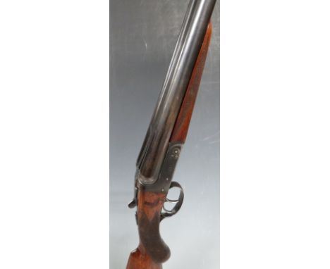 BSA 12 bore side by side shotgun with engraved locks, chequered semi-pistol grip and forend, double trigger and named 30 inch