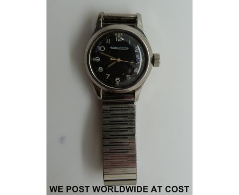 Jeager Le Coultre gentleman's military wristwatch with stainless steel case, black face, arabic numerals and luminous quarter