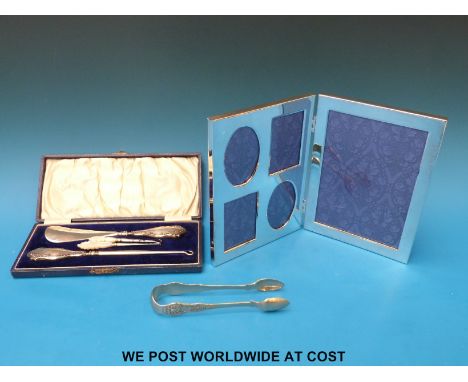 A boxed shoe horn with button hooks, having silver and mother of pearl handles together with a silver plated picture frame an